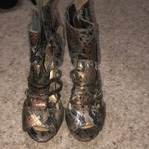 Bronze and black faux snake skin heels.